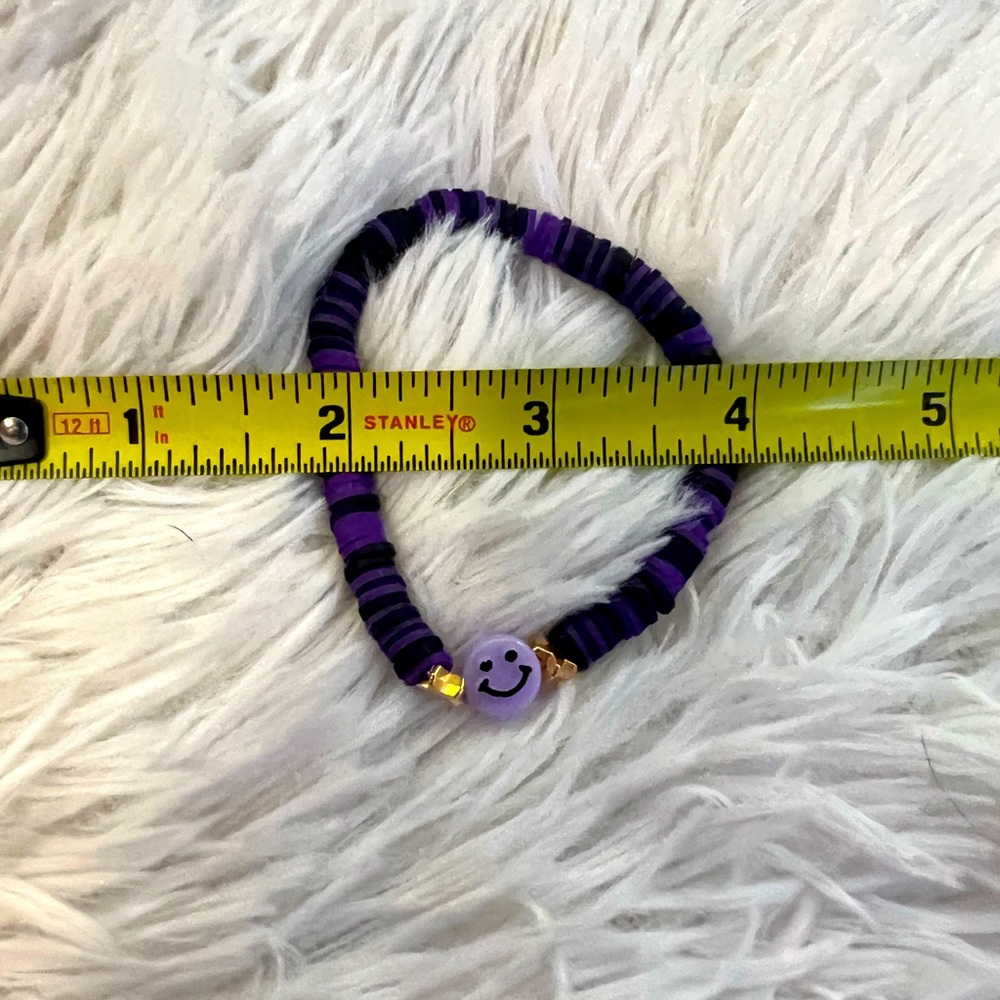 Purple and black bead bracelet with smiley face charm. Made with love!